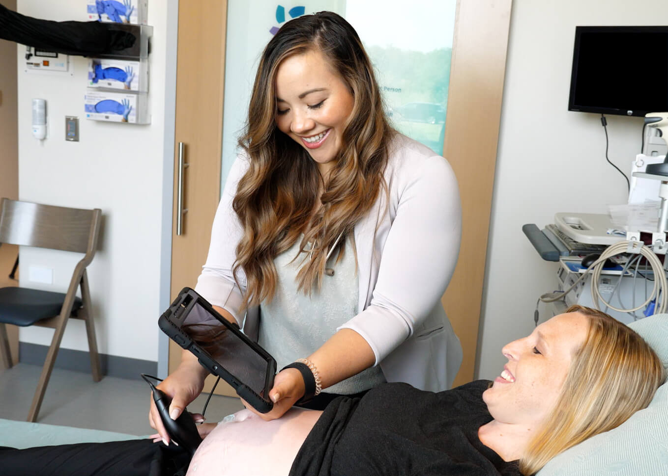 Dr. Paige Selvey examines an obstetrics patient.
